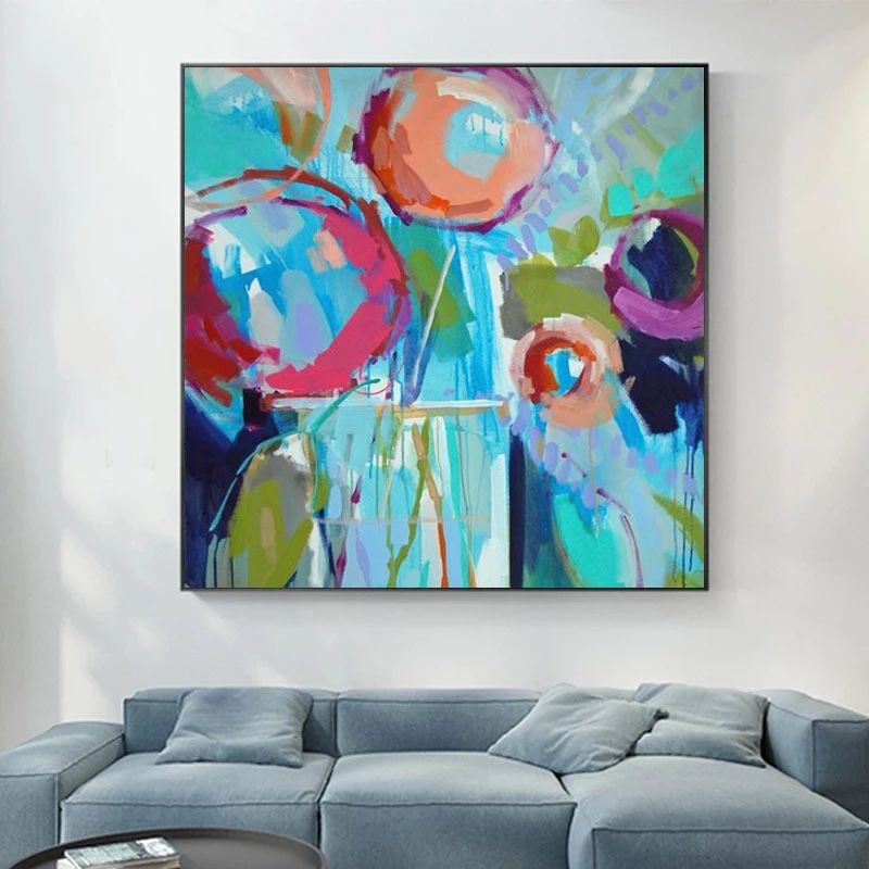 Vibrant hand-painted wall art featuring colorful fruits, adding vitality to modern living space.