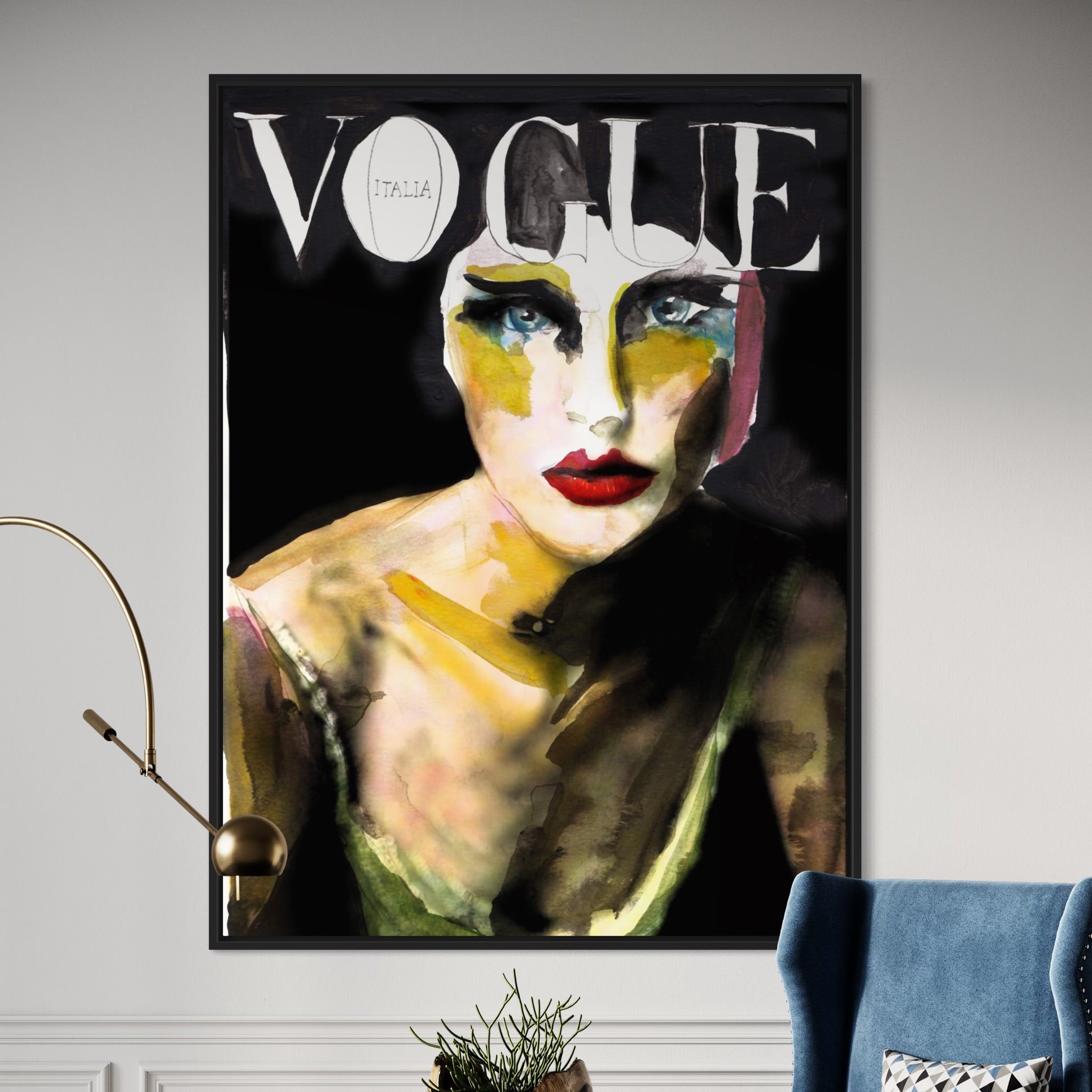 The 8 Vogue framed cover features an abstract painting of a woman with bold red lips and striking eyes against a black background. This contemporary art piece is elegantly displayed near a blue chair and plant, encapsulating high fashions essence.