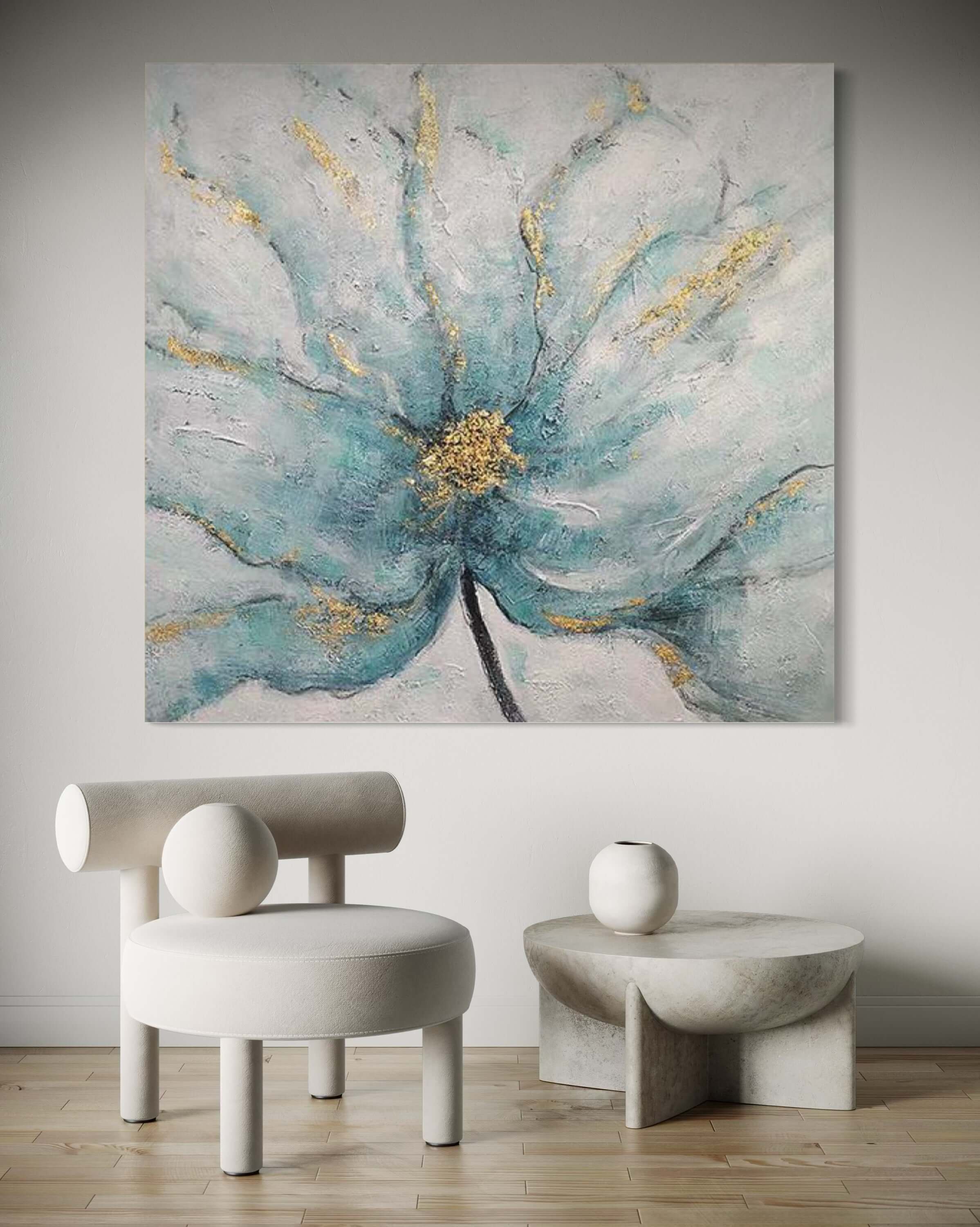 Artwork of a blue floral piece featuring gold accents, enhancing a modern interior design aesthetic.