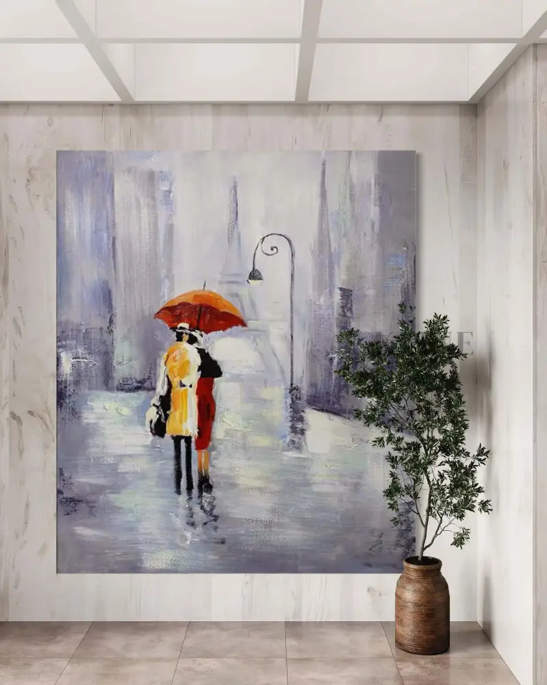 Hand-painted wall art of a couple under an orange umbrella, enhancing modern home decor with vibrant colors.
