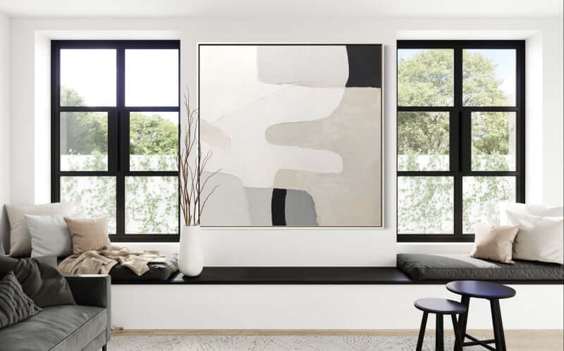 Hand-painted wall art by Kline Collective® in a modern living room, enhancing a bright and inviting space.