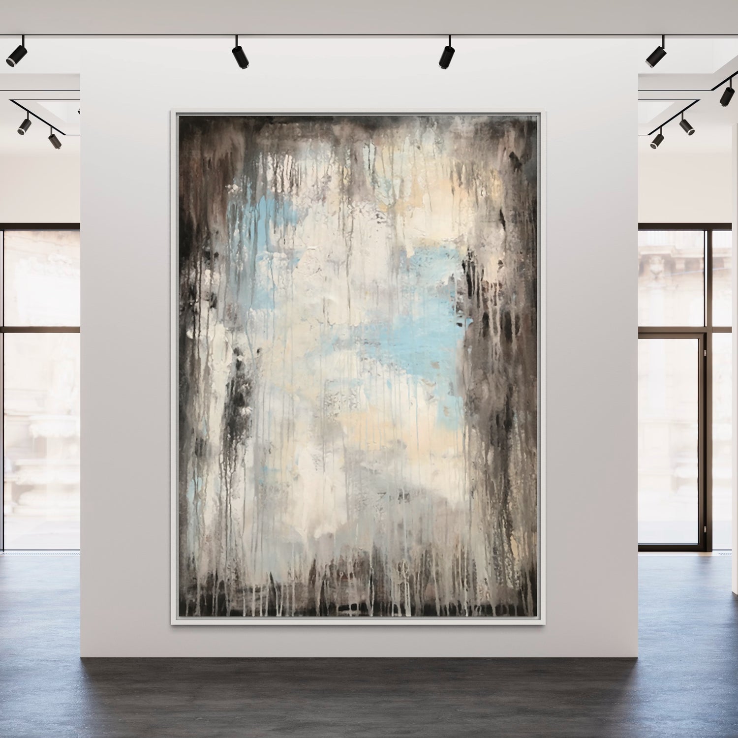 Large abstract wall painting in soft blues and earthy tones, enhancing modern living room decor.