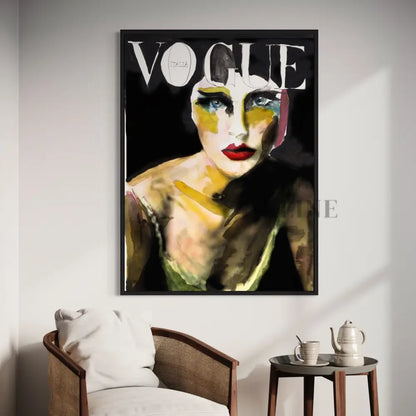 A framed 8 Vogue Italia cover with vibrant hand-painted wall art of a womans face adds flair to the space. A chair with a white cushion sits by a wooden table featuring a teapot and cup, offering an ambiance of high fashion and contemporary art.