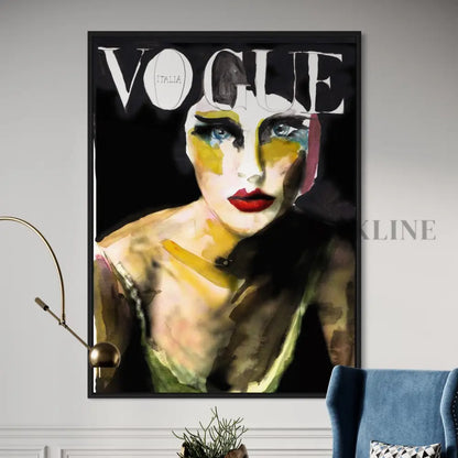 The 8 Vogue framed cover features an abstract painting of a woman with bold red lips and striking eyes against a black background. This contemporary art piece is elegantly displayed near a blue chair and plant, encapsulating high fashions essence.