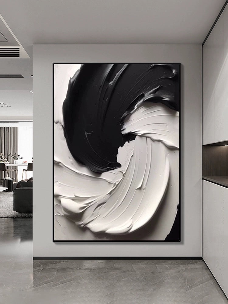 Black and white textured wall art showcasing dynamic paint layers and compelling contrast in a modern interior.