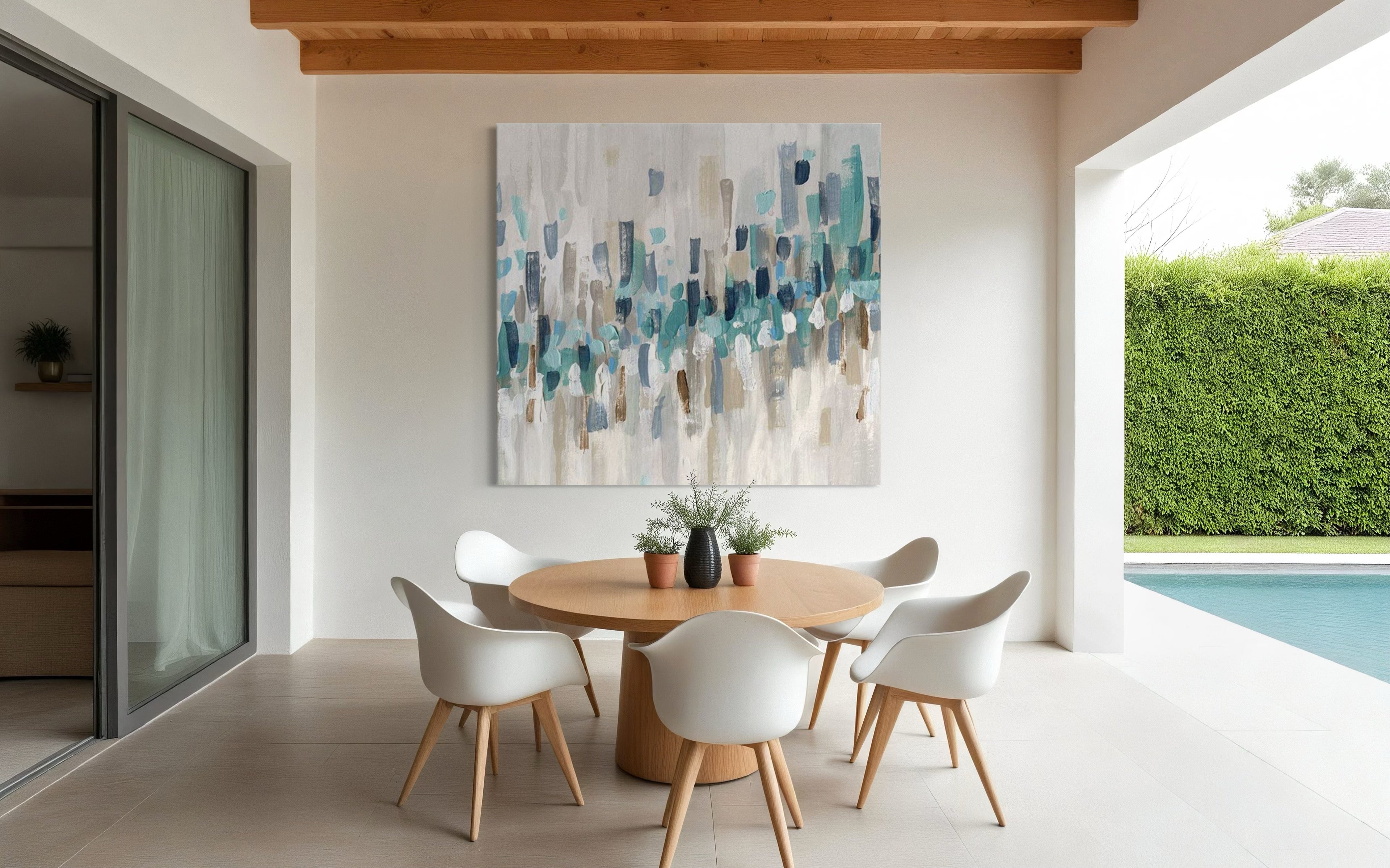 Higher Beings abstract artwork in serene colors above a modern dining table in a bright indoor space.