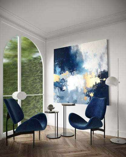 Stylish living space featuring blue chairs and contemporary hand-painted wall art &