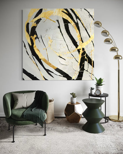 Hand-painted Noir and Gold Harmony wall art in modern living room with green chair and stylish decor.