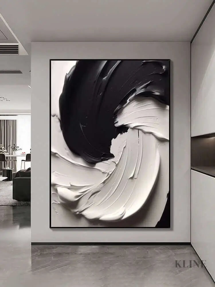 Black and white textured wall art showcasing dynamic paint layers and compelling contrast in a modern interior. 