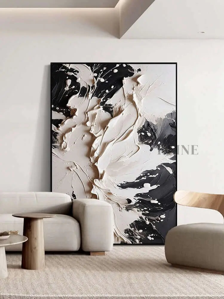Bold black and cream textured wall art adding luxury and sophistication to modern decor. Plaster Art