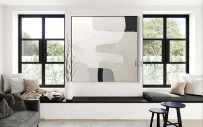 Hand-painted wall art by Kline Collective® in a modern living room, enhancing a bright and inviting space.