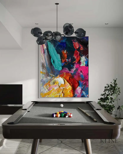Vibrant hand-painted wall art in a modern game room, bringing color and energy to the space.