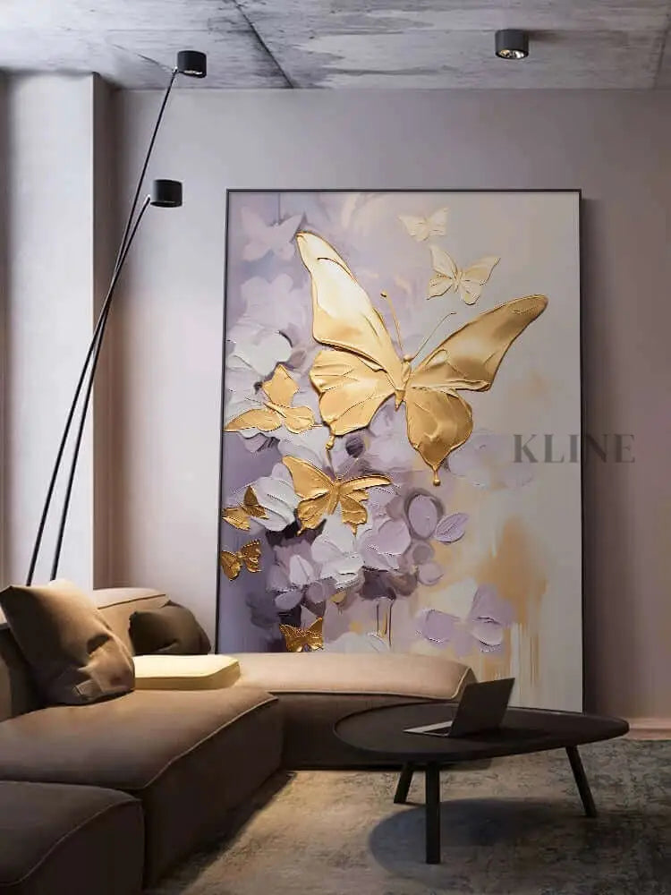 Golden Wings artwork featuring elegant golden butterflies on a purple background in a stylish living room.