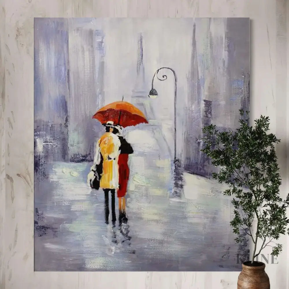 Hand-painted wall art featuring a couple under an orange umbrella in a rainy Paris street, by Kline Collective®. Shop All
