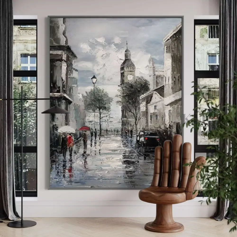 Hand-painted wall art depicting a Parisian street scene with wet pavement, umbrellas, and historic buildings. 