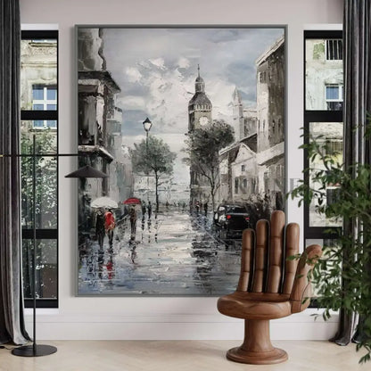 Hand-painted wall art depicting a Parisian street scene with wet pavement, umbrellas, and historic buildings.