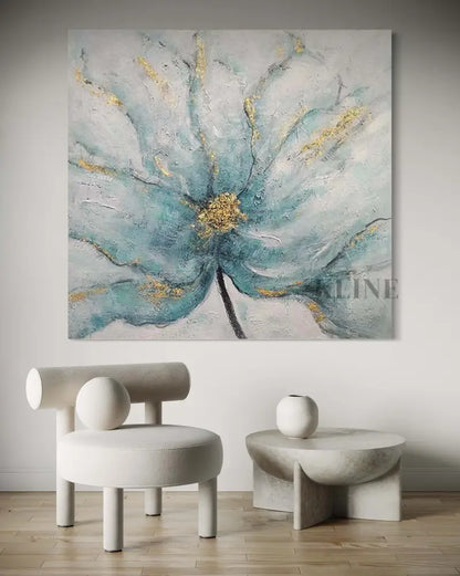 Artwork of a blue floral piece featuring gold accents, enhancing a modern interior design aesthetic.