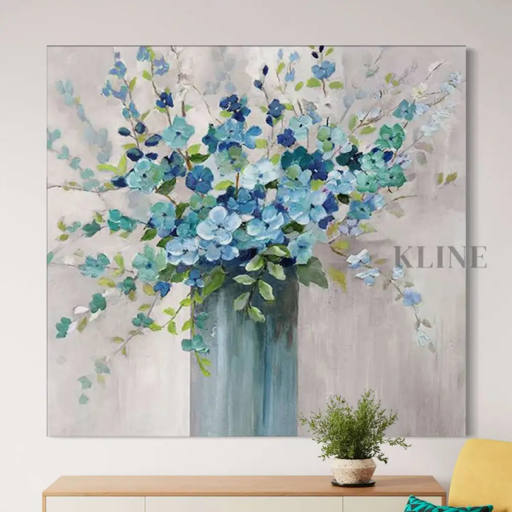 Hand-painted wall art featuring blue floral arrangement in vase, perfect for home decor by Kline Collective. 