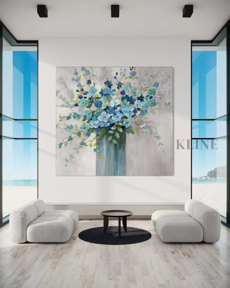 Hand-painted blue floral wall art in a modern living room by Kline Collective®, ready to elevate your space. 