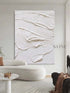White textured oil painting on wall, showcasing minimalism and intricate details in a modern living room.