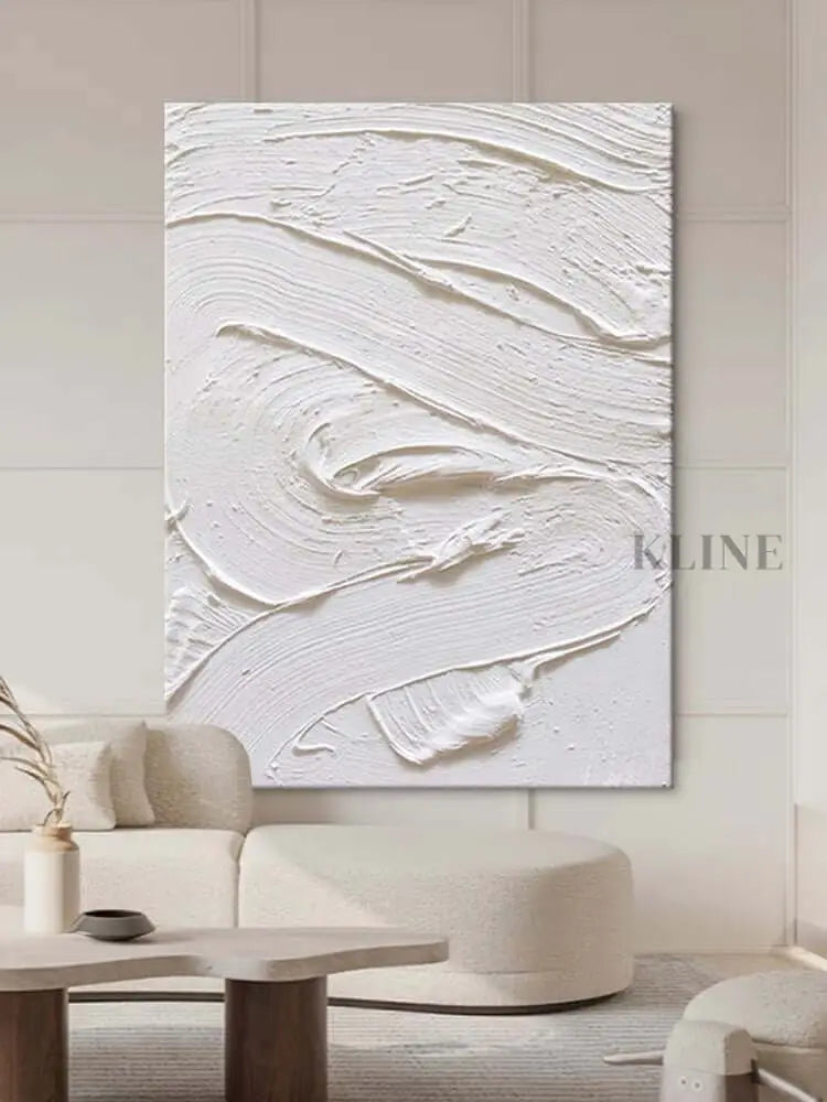 White textured oil painting abstract artwork hung in a modern living room, showcasing minimalist design and intricate surface detail. Pintura Minimalista